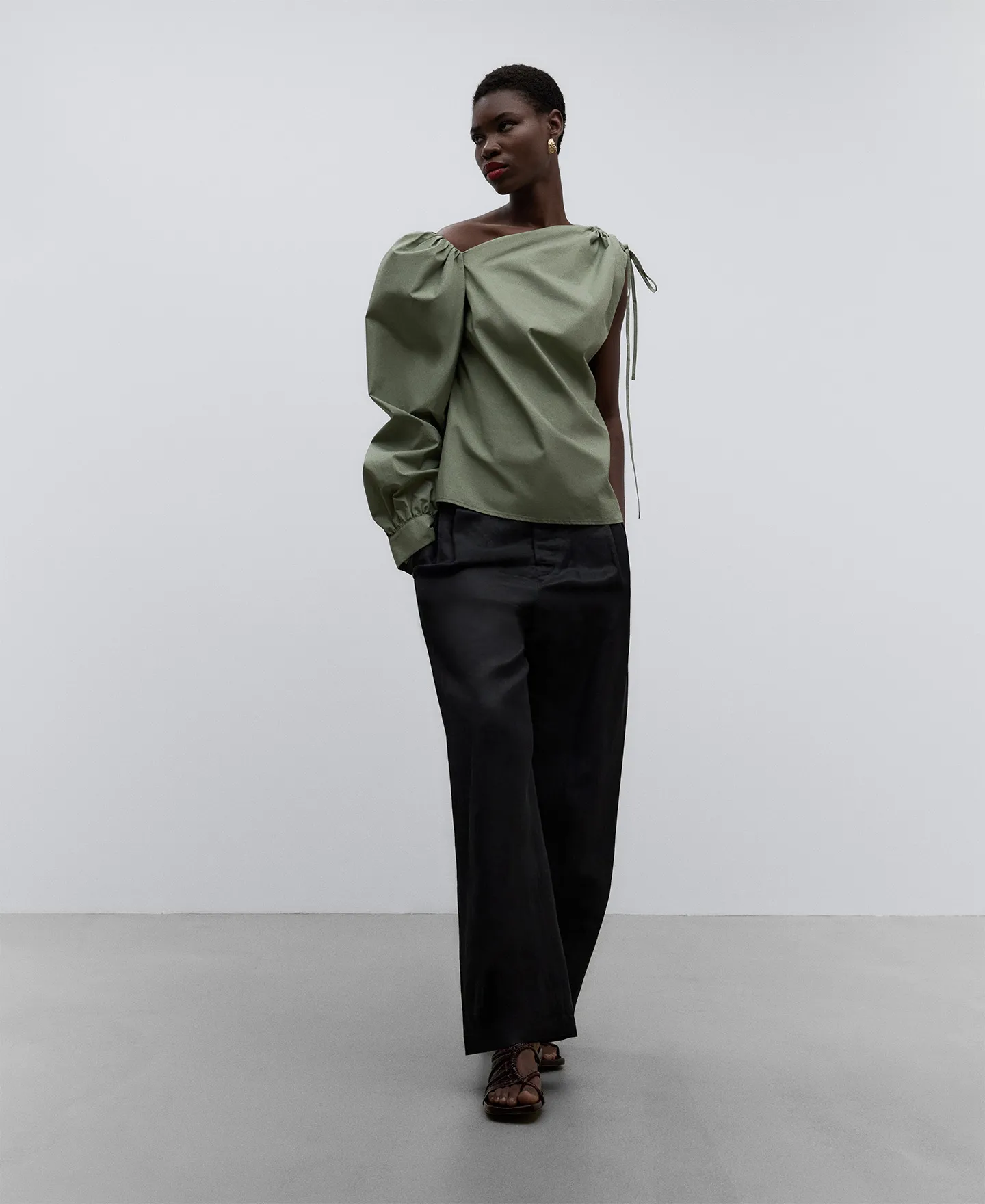 Green asymmetric top woman